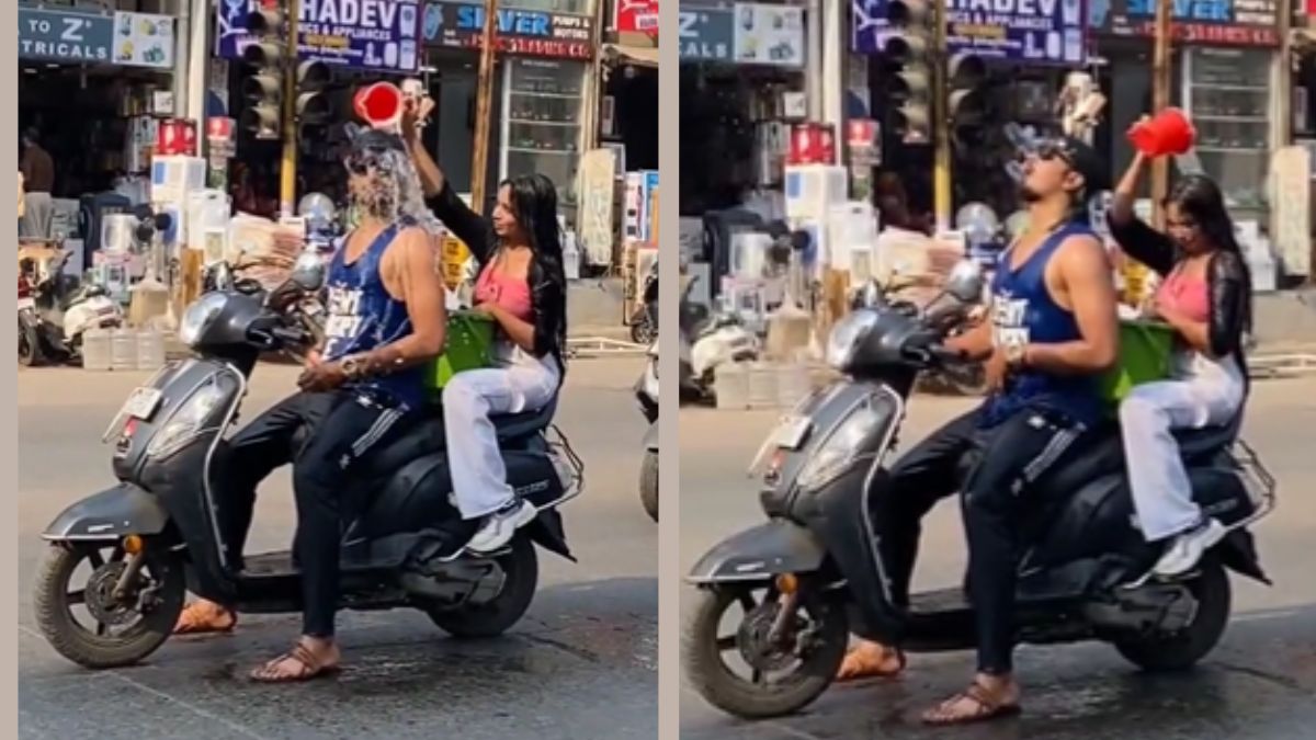 viral-video-man-and-woman-take-bath-while-riding-scooty-police-initiate-action