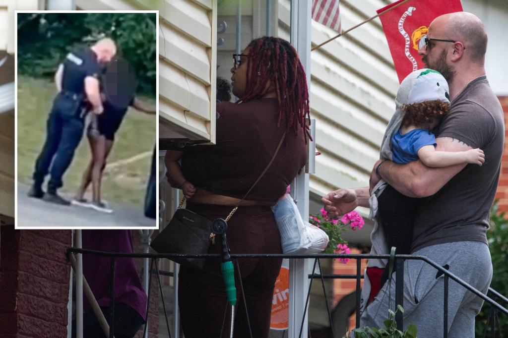 A Maryland police officer was caught kissing a woman in a viral video seen with his children and wife at home, hours after she said the lover could "rot in hell"
