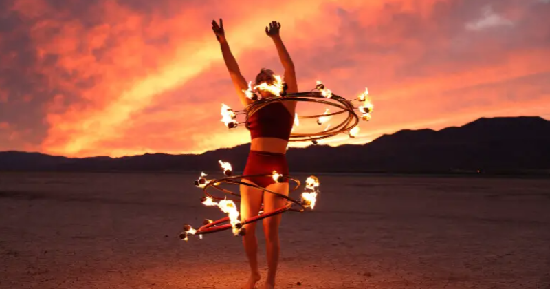 Circus performer uses eight flaming hula hoops to set new world record