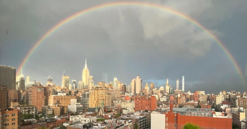 'Powerful symbol of hope': Stunning double rainbow shines over New York as crowds pay tribute to 9/11 victims