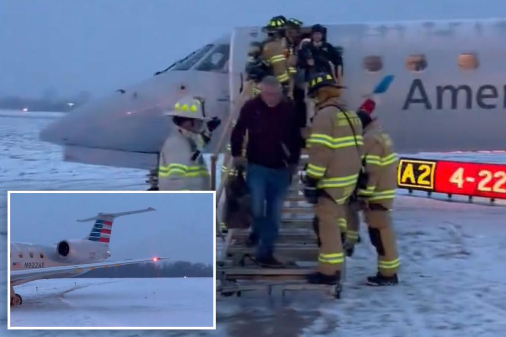 American Airlines plane carrying 53 passengers skids off 'snowy' New York runway after landing an hour late